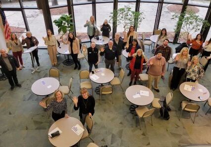 overhead shot of people waving